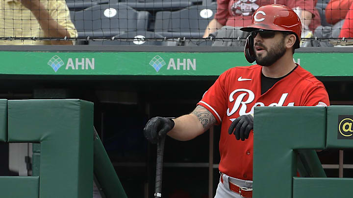 Cincinnati Reds third baseman Mike Moustakas (9) looks on from the dugout.