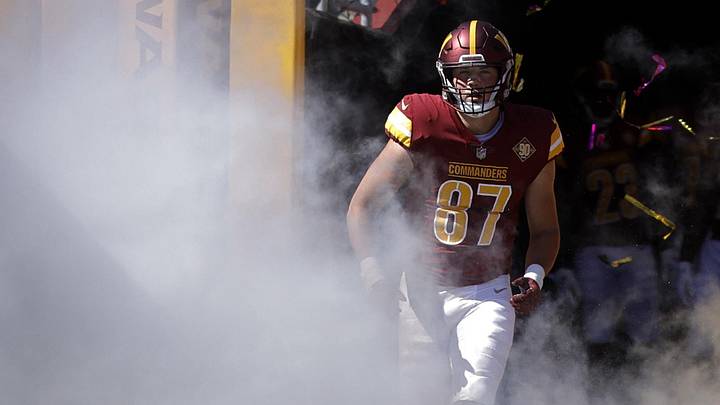 Landover, Maryland, USA; Washington Commanders tight end John Bates (87) runs out of the tunnel onto the field prior to the Commanders' game against the Tennessee Titans at FedExField. Mandatory Credit: Geoff Burke-Imagn Images