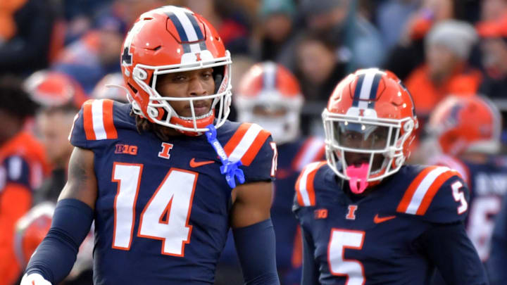 Nov 16, 2024; Champaign, Illinois, USA; Illinois Fighting Illini defensive back Xavier Scott (14) and Illinois Fighting Illini defensive back Torrie Cox Jr. (5) during the first half at Memorial Stadium. Mandatory Credit: Ron Johnson-Imagn Images Nov 16, 2024; Champaign, Illinois, USA; Illinois Fighting Illini defensive back Xavier Scott (14) and Illinois Fighting Illini defensive back Torrie Cox Jr. (5) during the first half at Memorial Stadium. Mandatory Credit: Ron Johnson-Imagn Images