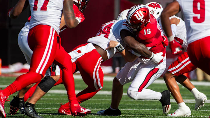 Indiana's Brendan Sorsby (15) is sacked during the first half of the Indiana versus Wisconsin football game at Memorial Stadium on Saturday, Nov. 4, 2023.