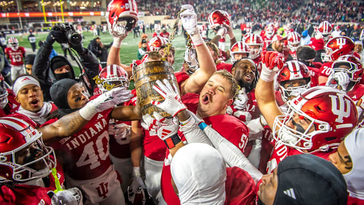 Indiana's Mike Katic (56) and the Hoosiers hoist the Old Oaken Bucket after the Indiana versus Purdue football game at Memorial Stadium on Saturday, Nov. 30, 2024. Indiana's Mike Katic (56) and the Hoosiers hoist the Old Oaken Bucket after the Indiana versus Purdue football game at Memorial Stadium on Saturday, Nov. 30, 2024.