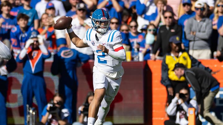 Nov 23, 2024; Gainesville, Florida, USA; Mississippi Rebels quarterback Jaxson Dart (2) throws the ball against the Florida Gators during the first half at Ben Hill Griffin Stadium. Mandatory Credit: Matt Pendleton-Imagn Images