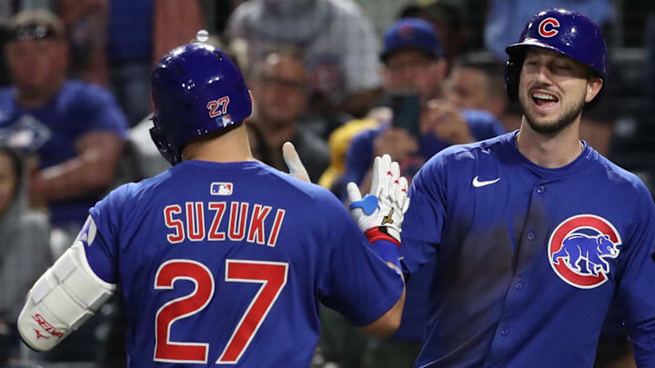 Pittsburgh, Pennsylvania, USA; Chicago Cubs right fielder Kyle Tucker (right) congratulates designated hitter Seiya Suzuki (27) after his two-run home run against the Pittsburgh Pirates during the seventh inning at PNC Park.