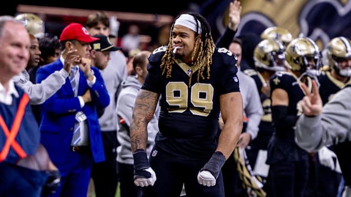 Dec 15, 2024; New Orleans, Louisiana, USA;  New Orleans Saints defensive end Chase Young (99) reacts to a score against the Washington Commanders during the second half at Caesars Superdome.