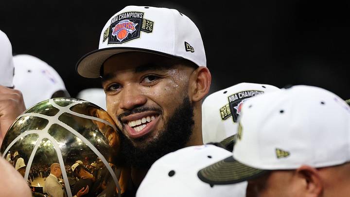 Jun 13, 2026; San Antonio, Texas, USA; New York Knicks center Karl-Anthony Towns holds the Larry O'Brien championship trophy during the championship celebration after game five of the 2026 NBA Finals against the San Antonio Spurs at Frost Bank Center.