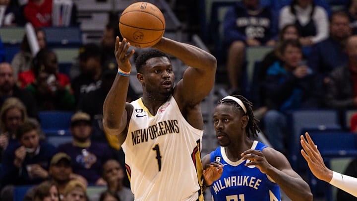 Dec 19, 2022; New Orleans, Louisiana, USA; New Orleans Pelicans forward Zion Williamson (1) looks to pass the ball against Milwaukee Bucks guard Jrue Holiday (21) during the second half at Smoothie King Center. Mandatory Credit: Stephen Lew-Imagn Images