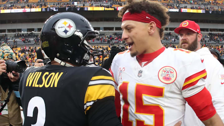 Dec 25, 2024; Pittsburgh, Pennsylvania, USA;  Pittsburgh Steelers quarterback Russell Wilson (3) and Kansas City Chiefs quarterback Patrick Mahomes (15) greet each other after their game at Acrisure Stadium. Mandatory Credit: Charles LeClaire-Imagn Images