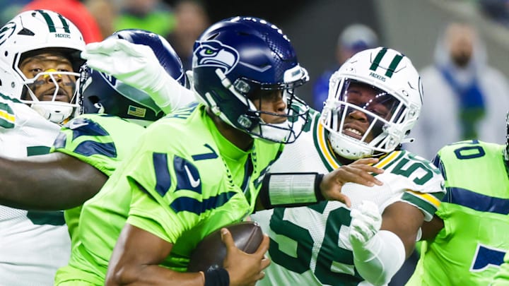 Green Bay Packers linebacker Edgerrin Cooper (56) sacks Seattle Seahawks quarterback Geno Smith.