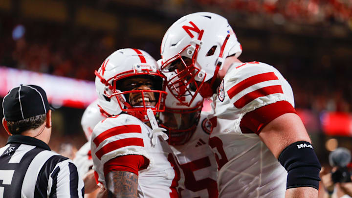 Wide receiver Nyziah Hunter (left) celebrates with teammates after his touchdown reception late in the first half against Cincinnati. Wide receiver Nyziah Hunter (left) celebrates with teammates after his touchdown reception late in the first half against Cincinnati.