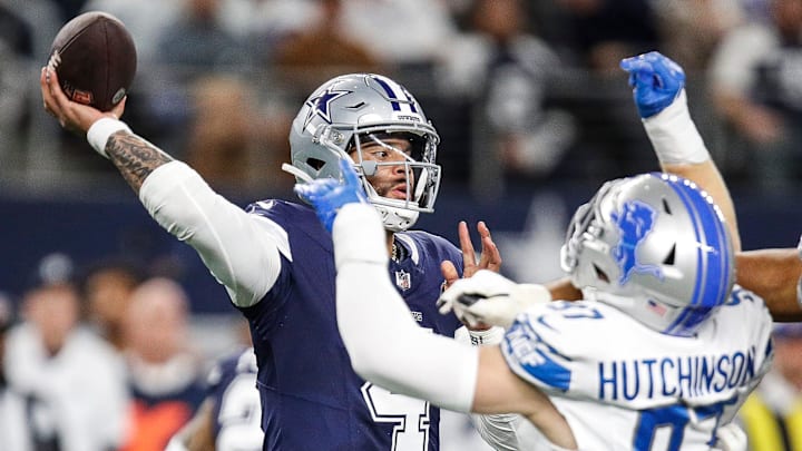 Detroit Lions defensive end Aidan Hutchinson tries to sack Dallas Cowboys quarterback Dak Prescott