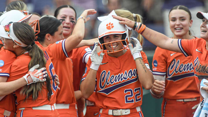 Clemson freshman Taylor Pipkins (22) is greeted by teammates after a walk-off RBI double after the Tigers beat the Spartans 10-2 in the NCAA Softball Tournament Clemson Regional at McWhorter Stadium in Clemson Friday, May 16, 2025.