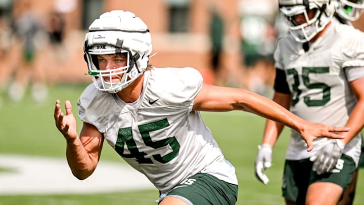 Michigan State's Brady Pretzlaff runs a drill during the first day of football camp on Tuesday, July 30, 2024, in East Lansing.
