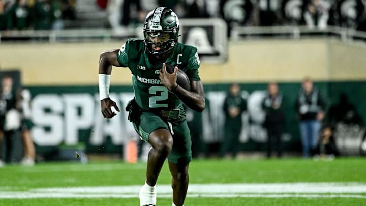 Michigan State's Aidan Chiles runs for a gain against Iowa in the second quarter on Saturday, Oct. 19, 2024, at Spartan Stadium in East Lansing.