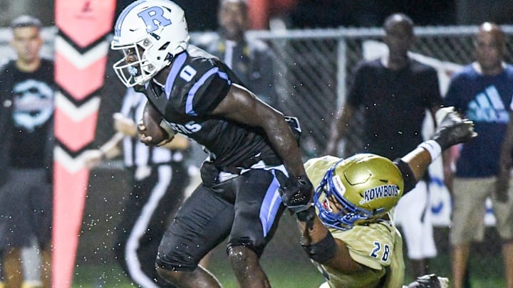 Jaylen Hayward of Rockledge shakes the tackle of Osceola tackler Elijah Melendez doing their game