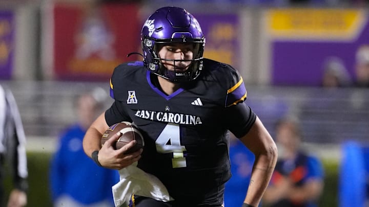 Oct 16, 2025; Greenville, North Carolina, USA; East Carolina Pirates quarterback Katin Houser (4) runs with the ball against the Tulsa Golden Hurricane during the second half at Dowdy-Ficklen Stadium. Mandatory Credit: James Guillory-Imagn Images Oct 16, 2025; Greenville, North Carolina, USA; East Carolina Pirates quarterback Katin Houser (4) runs with the ball against the Tulsa Golden Hurricane during the second half at Dowdy-Ficklen Stadium. Mandatory Credit: James Guillory-Imagn Images
