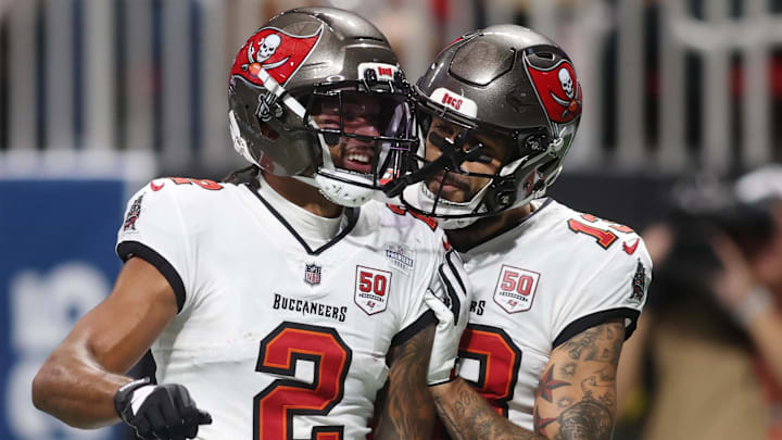 Sep 7, 2025; Atlanta, Georgia, USA; Tampa Bay Buccaneers wide receiver Emeka Egbuka (2) celebrates with wide receiver Mike Evans (13) after scoring a touchdown against the Atlanta Falcons during the second quarter at Mercedes-Benz Stadium. Mandatory Credit: Brett Davis-Imagn Images