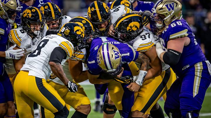 Demond Williams Jr. gets gang-tackled by Iowa defenders. Demond Williams Jr. gets gang-tackled by Iowa defenders.