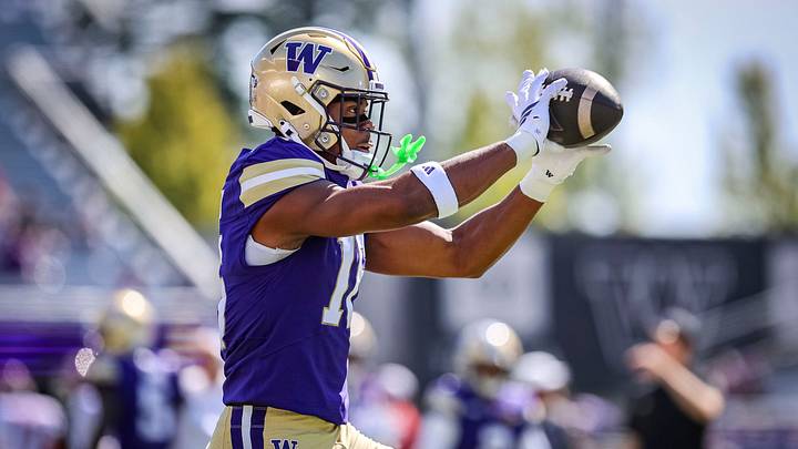 Justice Williams catches a ball in warm-ups for the Huskies. 