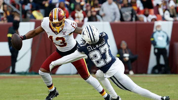 Dec 25, 2025; Landover, Maryland, USA; Washington Commanders wide receiver Treylon Burks (13) runs with the ball as Dallas Cowboys cornerback Reddy Steward (27) chases during the second half at Northwest Stadium. Mandatory Credit: Geoff Burke-Imagn Images Dec 25, 2025; Landover, Maryland, USA; Washington Commanders wide receiver Treylon Burks (13) runs with the ball as Dallas Cowboys cornerback Reddy Steward (27) chases during the second half at Northwest Stadium. Mandatory Credit: Geoff Burke-Imagn Images