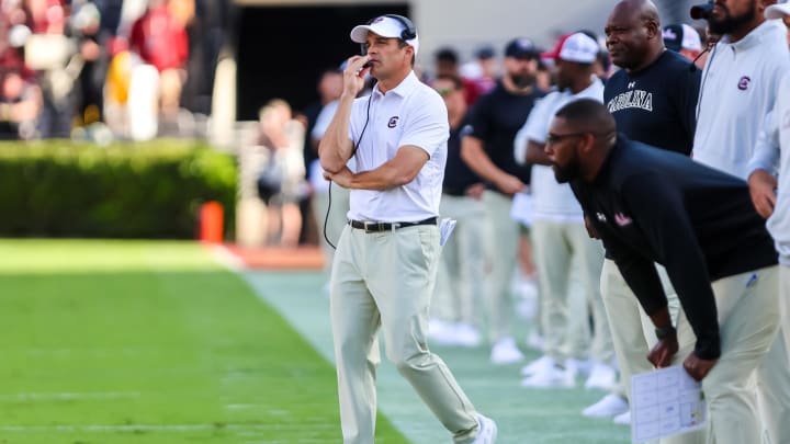 Oct 14, 2023; Columbia, South Carolina, USA; South Carolina Gamecocks head coach Shane Beamer talks on the headset during his team's game versus the Florida Gators