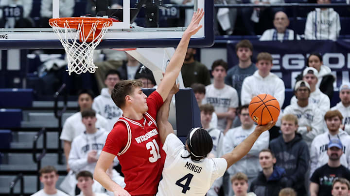 Jan 22, 2026; University Park, Pennsylvania, USA; Wisconsin Badgers forward Nolan Winter (31) defends Penn State Nittany Lions guard Kayden Mingo (4) during the first half at Rec Hall. Jan 22, 2026; University Park, Pennsylvania, USA; Wisconsin Badgers forward Nolan Winter (31) defends Penn State Nittany Lions guard Kayden Mingo (4) during the first half at Rec Hall.