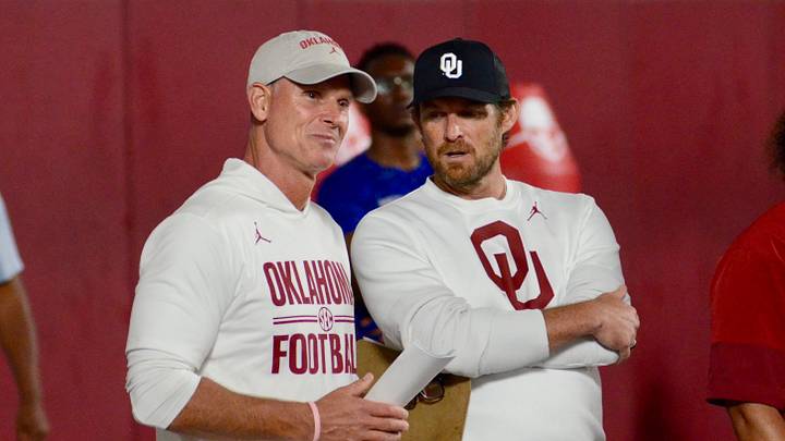 Oklahoma coach Brent Venables and general manager Jim Nagy talk during one of the Sooners' elite prospect camps.