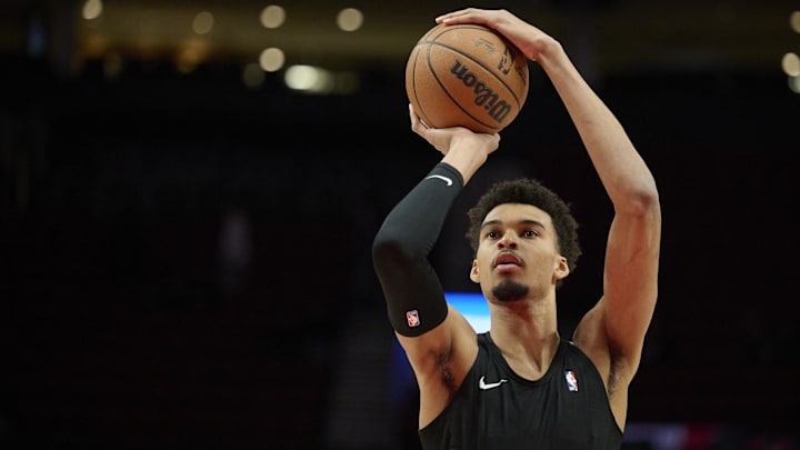 Dec 13, 2024; Portland, Oregon, USA; San Antonio Spurs center Victor Wembanyama (1) warms up before a game against the Portland Trail Blazers at Moda Center.