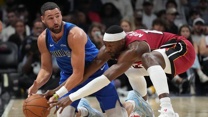 Nov 24, 2025; Miami, Florida, USA; Dallas Mavericks guard Klay Thompson (31) and Miami Heat center Bam Adebayo (13) battle for a loose ball during the second half at Kaseya Center. Mandatory Credit: Jim Rassol-Imagn Images Nov 24, 2025; Miami, Florida, USA; Dallas Mavericks guard Klay Thompson (31) and Miami Heat center Bam Adebayo (13) battle for a loose ball during the second half at Kaseya Center. Mandatory Credit: Jim Rassol-Imagn Images