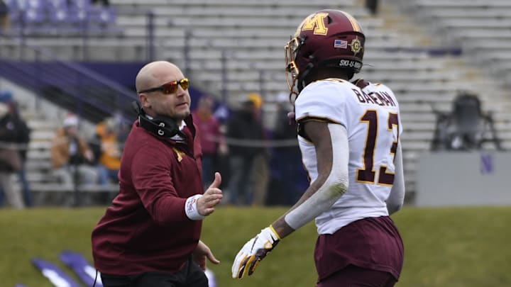 Nov 23, 2019; Evanston, IL, USA; Minnesota Golden Gophers head coach PJ Fleck congratulates Minnesota Golden Gophers wide receiver Rashod Bateman (13) after his touchdown against the Northwestern Wildcats during the first half at Ryan Field. Mandatory Credit: David Banks-Imagn Images