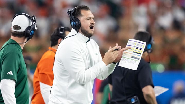 Jan 8, 2026; Glendale, AZ, USA; Miami Hurricanes tight ends coach Cody Woodiel against the Mississippi Rebels during the 2026 Fiesta Bowl and semifinal game of the College Football Playoff at State Farm Stadium. Mandatory Credit: Mark J. Rebilas-Imagn Images Jan 8, 2026; Glendale, AZ, USA; Miami Hurricanes tight ends coach Cody Woodiel against the Mississippi Rebels during the 2026 Fiesta Bowl and semifinal game of the College Football Playoff at State Farm Stadium. Mandatory Credit: Mark J. Rebilas-Imagn Images