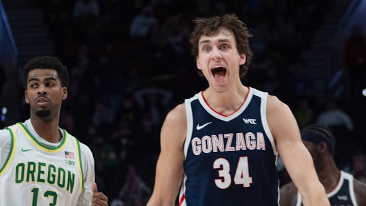 Gonzaga’s Braden Huff, right, reacts at the Bulldogs move ahead of Oregon during the second half of the Northwest Elite Showdown at the Moda Center in Portland Dec. 21, 2025. 