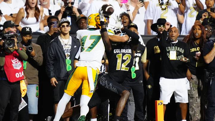 Aug 29, 2024; Boulder, Colorado, USA; Colorado Buffaloes wide receiver Travis Hunter (12) pulls in a touchdown reception past North Dakota State Bison cornerback Jailen Duffie (17) in the second half at Folsom Field. Mandatory Credit: Ron Chenoy-USA TODAY Sports Aug 29, 2024; Boulder, Colorado, USA; Colorado Buffaloes wide receiver Travis Hunter (12) pulls in a touchdown reception past North Dakota State Bison cornerback Jailen Duffie (17) in the second half at Folsom Field. Mandatory Credit: Ron Chenoy-USA TODAY Sports