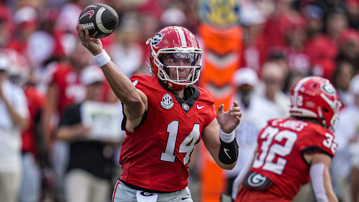 Aug 30, 2025; Athens, Georgia, USA; Georgia Bulldogs quarterback Gunner Stockton (14) passes the ball against the Marshall Thundering Herd during the first quarter at Sanford Stadium. Mandatory Credit: Dale Zanine-Imagn Images
