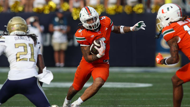 Nov 9, 2024; Atlanta, Georgia, USA; Miami Hurricanes running back Damien Martinez (6) runs the ball against the Georgia Tech Yellow Jackets in the fourth quarter at Bobby Dodd Stadium at Hyundai Field. Mandatory Credit: Brett Davis-Imagn Images Nov 9, 2024; Atlanta, Georgia, USA; Miami Hurricanes running back Damien Martinez (6) runs the ball against the Georgia Tech Yellow Jackets in the fourth quarter at Bobby Dodd Stadium at Hyundai Field. Mandatory Credit: Brett Davis-Imagn Images