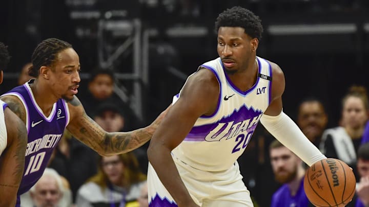 Feb 11, 2026; Salt Lake City, Utah, USA; Utah Jazz forward Jaren Jackson Jr. (20) plans his next move around Sacramento Kings guard/forward DeMar DeRozan (10) during the first half at Delta Center. Mandatory Credit: Peter Creveling-Imagn Images