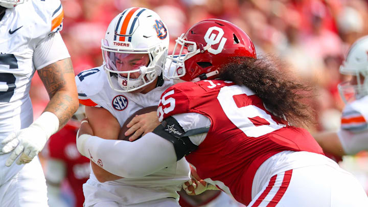 Oklahoma Sooners defensive lineman Jayden Jackson (65) tackles Auburn Tigers quarterback Jackson Arnold (11). Oklahoma Sooners defensive lineman Jayden Jackson (65) tackles Auburn Tigers quarterback Jackson Arnold (11).