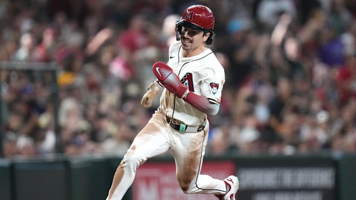 Arizona Diamondbacks Corbin Carroll (7) rounds third base to score a run against the San Diego Padres at Chase Field in Phoenix on Sept. 29, 2024.