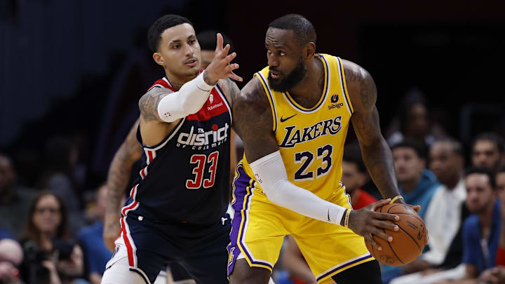 Apr 3, 2024; Washington, District of Columbia, USA; Los Angeles Lakers forward LeBron James (23) holds the ball as Washington Wizards forward Kyle Kuzma (33) defends in the second half at Capital One Arena. Apr 3, 2024; Washington, District of Columbia, USA; Los Angeles Lakers forward LeBron James (23) holds the ball as Washington Wizards forward Kyle Kuzma (33) defends in the second half at Capital One Arena.