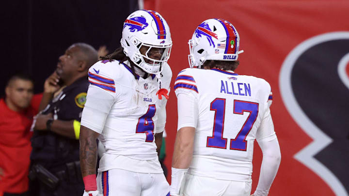 Buffalo Bills running back James Cook III (4) celebrates with quarterback Josh Allen (17) after scoring a touchdown against the Houston Texans in the first quarter at NRG Stadium.