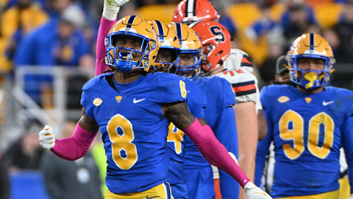 Oct 24, 2024; Pittsburgh, Pennsylvania, USA; Pittsburgh Panthers defensive back Tamon Lynum (8) celebrates a tackle of Syracuse Orange running back LeQuint Allen (1) during the third quarter at Acrisure Stadium. Mandatory Credit: Barry Reeger-Imagn Images Oct 24, 2024; Pittsburgh, Pennsylvania, USA; Pittsburgh Panthers defensive back Tamon Lynum (8) celebrates a tackle of Syracuse Orange running back LeQuint Allen (1) during the third quarter at Acrisure Stadium. Mandatory Credit: Barry Reeger-Imagn Images