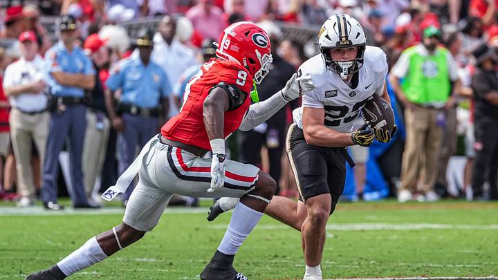 Oct 3, 2026; Athens, Georgia, USA; Vanderbilt Commodores running back Evan Hampton (23) runs against Georgia Bulldogs linebacker Chris Cole (9) at Sanford Stadium. Mandatory Credit: Dale Zanine-Imagn Images Oct 3, 2026; Athens, Georgia, USA; Vanderbilt Commodores running back Evan Hampton (23) runs against Georgia Bulldogs linebacker Chris Cole (9) at Sanford Stadium. Mandatory Credit: Dale Zanine-Imagn Images