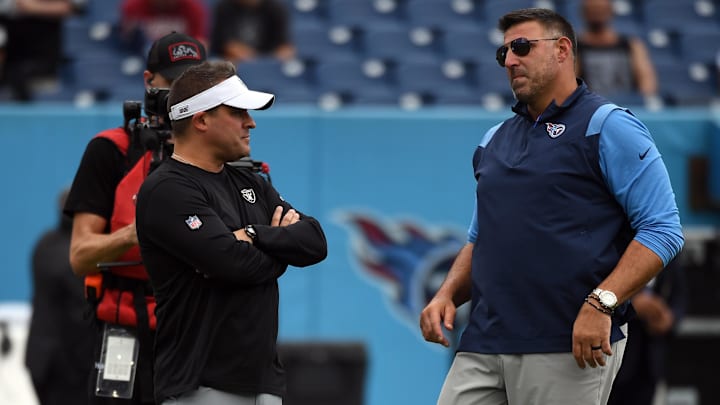 Sep 25, 2022; Nashville, Tennessee, USA; Las Vegas Raiders head coach Josh McDaniels (left) talks with Tennessee Titans head coach Mike Vrabel (right) before the game at Nissan Stadium. Mandatory Credit: Christopher Hanewinckel-Imagn Images