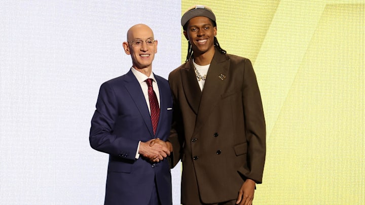 Cody Williams poses for photos with NBA commissioner Adam Silver after being selected in the first round by the Utah Jazz.