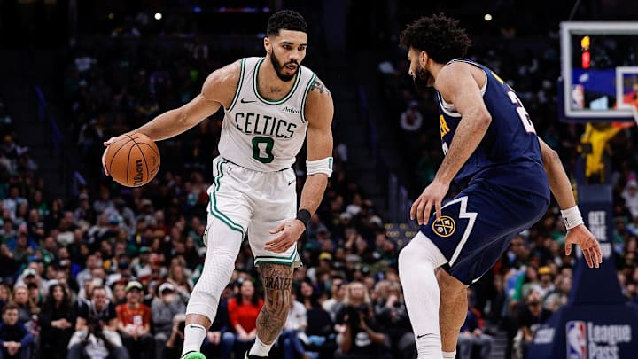Jan 7, 2025; Denver, Colorado, USA; Boston Celtics forward Jayson Tatum (0) controls the ball as Denver Nuggets guard Jamal Murray (27) guards in the fourth quarter at Ball Arena. Mandatory Credit: Isaiah J. Downing-Imagn Images Jan 7, 2025; Denver, Colorado, USA; Boston Celtics forward Jayson Tatum (0) controls the ball as Denver Nuggets guard Jamal Murray (27) guards in the fourth quarter at Ball Arena. Mandatory Credit: Isaiah J. Downing-Imagn Images