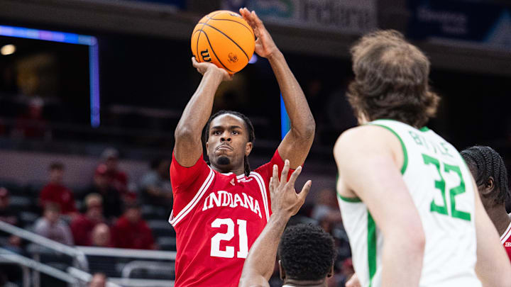 Indiana Hoosiers forward Mackenzie Mgbako (21) shoots the ball while Oregon Ducks guard TJ Bamba (5) defends in the first half at Gainbridge Fieldhouse.
