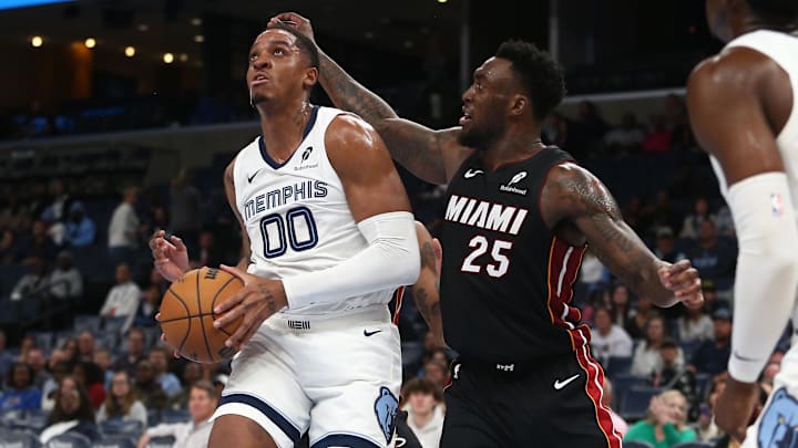 Oct 18, 2024; Memphis, Tennessee, USA; Memphis Grizzlies forward Armando Bacot (00) drives to the basket as Miami Heat forward Nassir Little (25) defends during the second half at FedExForum. Mandatory Credit: Petre Thomas-Imagn Images