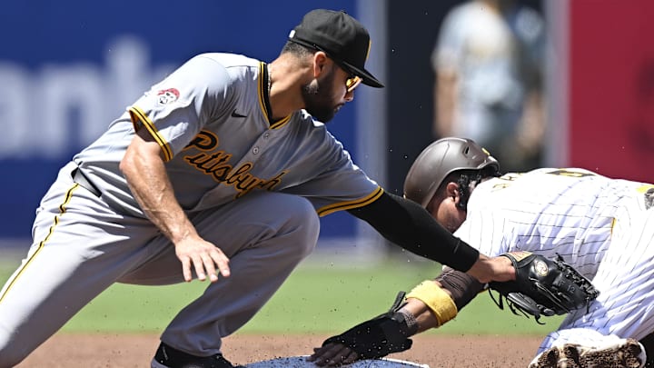 San Diego Padres first baseman Luis Arraez (4) steals second base against Pittsburgh Pirates third base Isiah Kiner-Falefa (7) during the first inning at Petco Park.