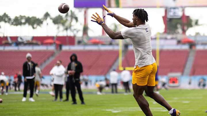 Jan 1, 2024; Tampa, FL, USA; LSU Tigers wide receiver Malik Nabers (8) makes a catch before the game Jan 1, 2024; Tampa, FL, USA; LSU Tigers wide receiver Malik Nabers (8) makes a catch before the game