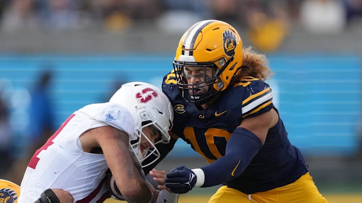Nov 23, 2024; Berkeley, California, USA; California Golden Bears linebacker Teddye Buchanan (right) tackles Stanford Cardinal quarterback Ashton Daniels (left) during the fourth quarter at California Memorial Stadium. Mandatory Credit: Darren Yamashita-Imagn Images