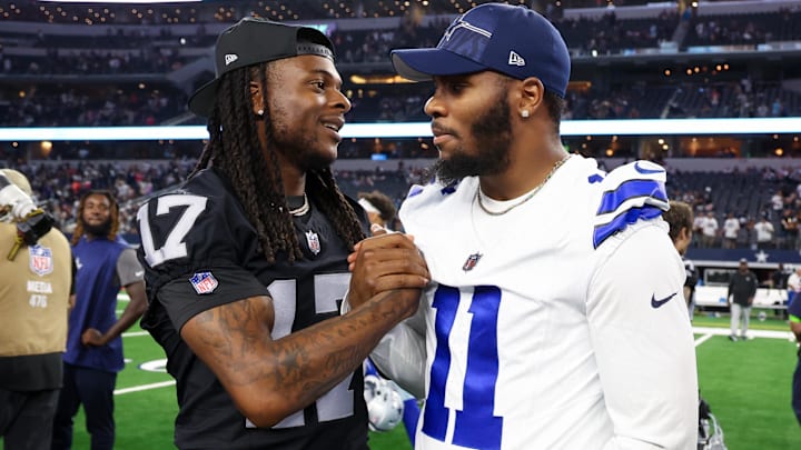 Las Vegas Raiders wide receiver Davante Adams greets Dallas Cowboys star Micah Parsons after the game at AT&T Stadium. 